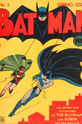 Batman #1 (1940). Batman and Robin on the cover; the Cat (future Catwoman) debuts inside alongside the Joker.